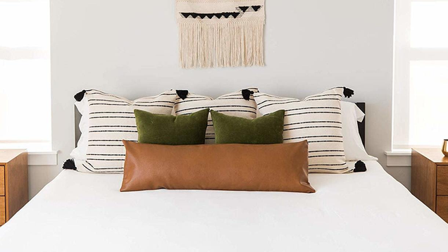 This extra long, leather lumbar pillow cover elevates that pillow that you used in college to turn your bed into a makeshift couch.
